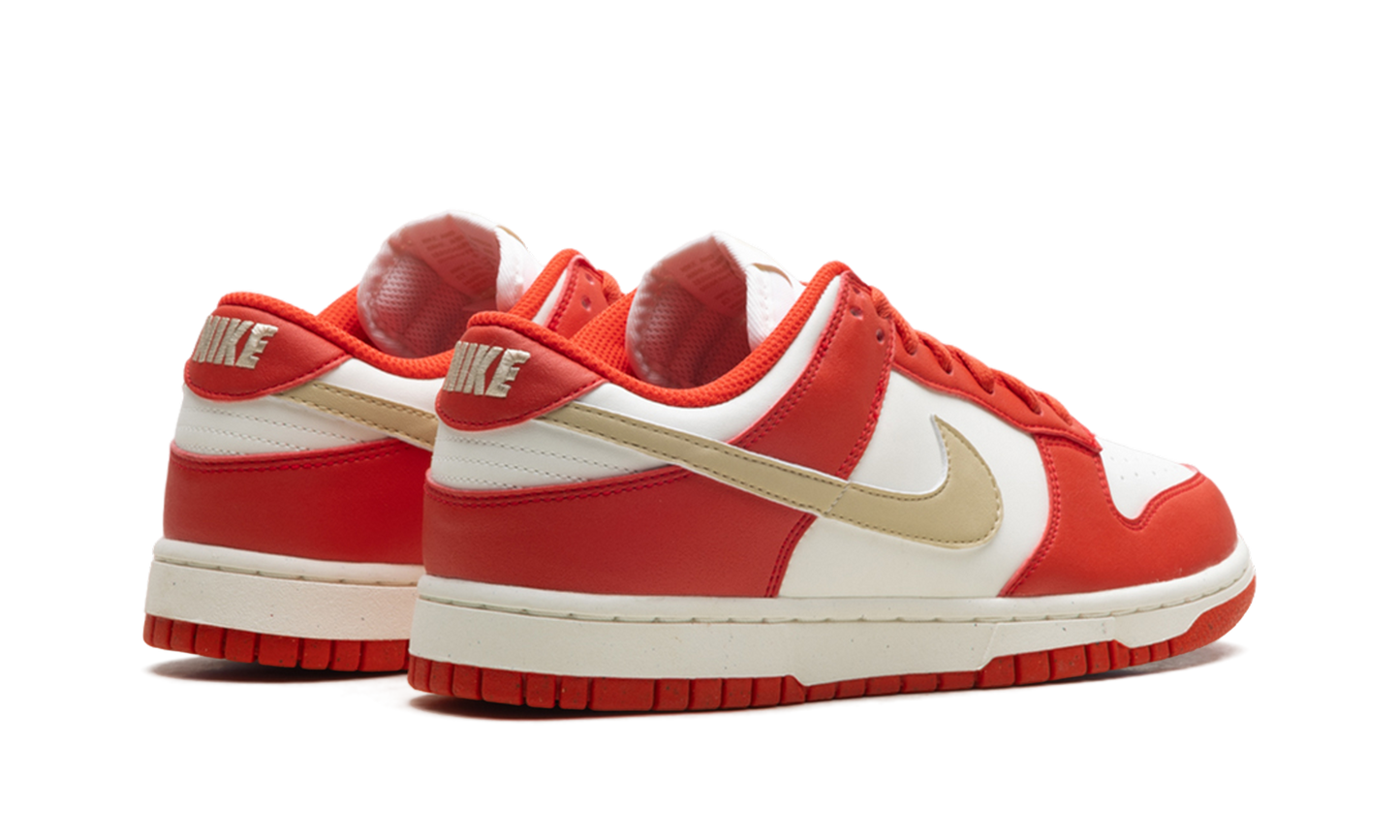 Dunk Low Next Nature WMNS Light Crimson Team Gold